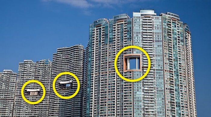 Хонконгийн тэнгэр баганадсан цамхагуудад яагаад ийм “нүх” байдаг вэ?